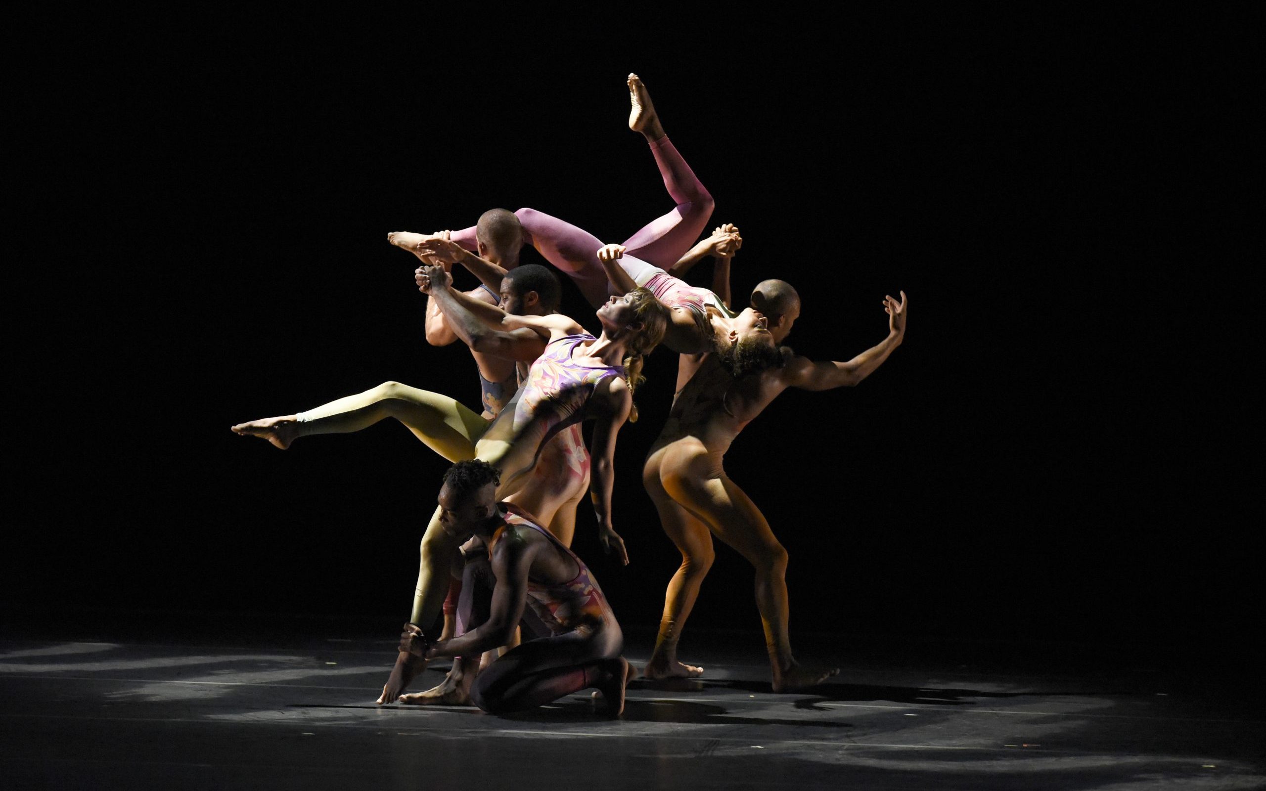 6 dancers in various stages of jumping.