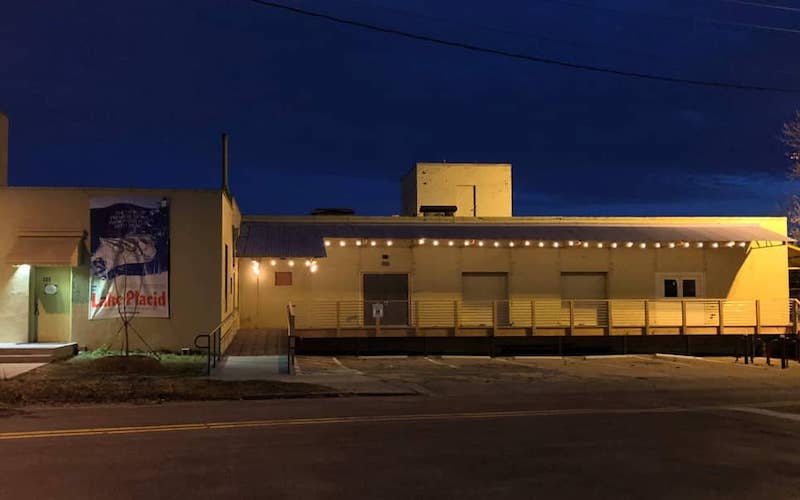 A small yellow building at night