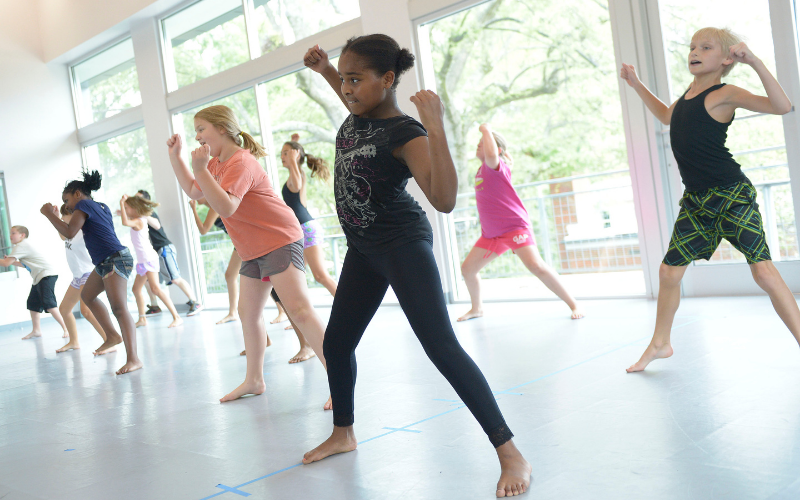 Students in ADF teen dance camp doing a dance in unison