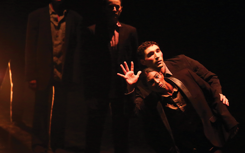 3 artists from the TL Collective performing on stage