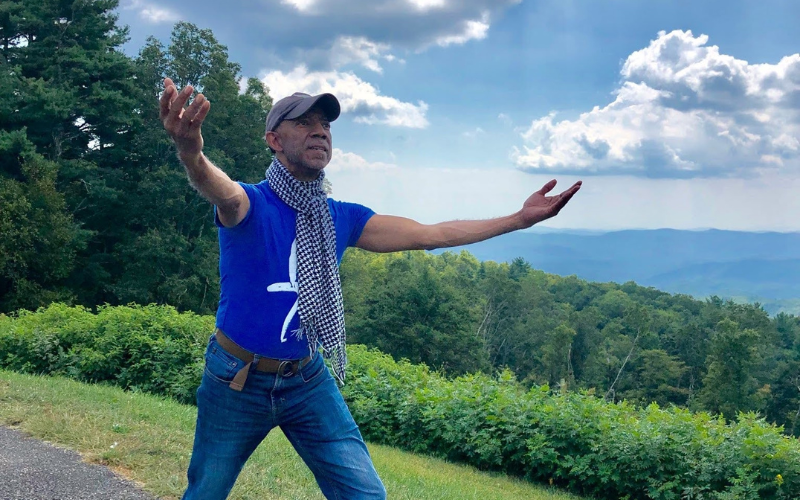 7 dancers jumping in a white room.